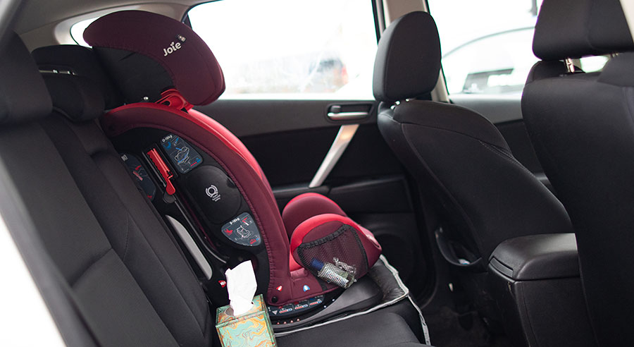Child car seat installed in the car